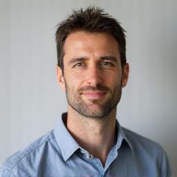 Professional headshot of team member.